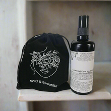 Load image into Gallery viewer,  Celestial Dew Hydrosol Mist is carefully packaged in a black velvet pouch to protect its potency from light, offering you a lasting gift that goes  beyond the product itself.
