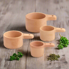 Load image into Gallery viewer, A set of natural wood measuring cups 
