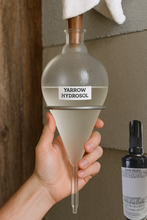 Load image into Gallery viewer, We gently separate the volatile essential oils during distillation, leaving behind a water-based extract that is gentler on the skin, ideal for sensitive individuals. This makes our hydrolat a more soothing, energetically pure expression of the plant—perfect for topical use, ritual misting, or emotional support.
